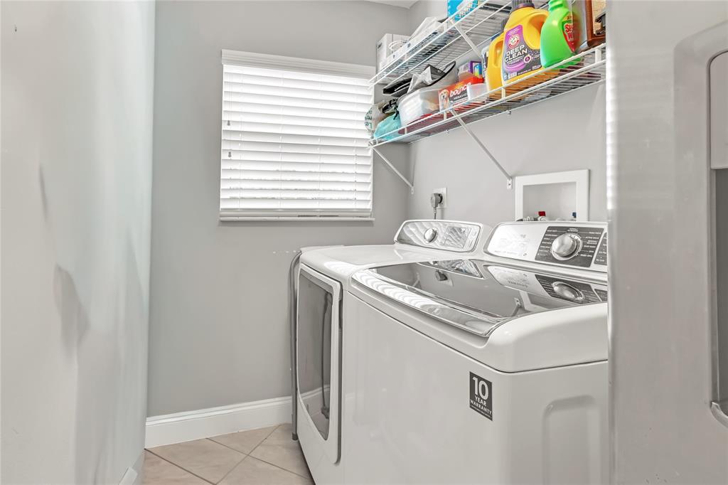 8324 Northwest 80th Street Tamarac, FL 33321 - Photo 29 of 40 a utility room with dryer and washer