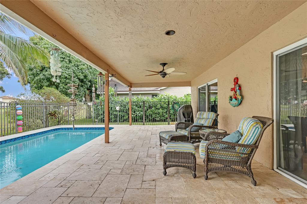 8324 Northwest 80th Street Tamarac, FL 33321 - Photo 32 of 40 a building outdoor space with patio furniture and garden view