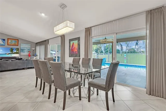 a view of a swimming pool with a table and chairs