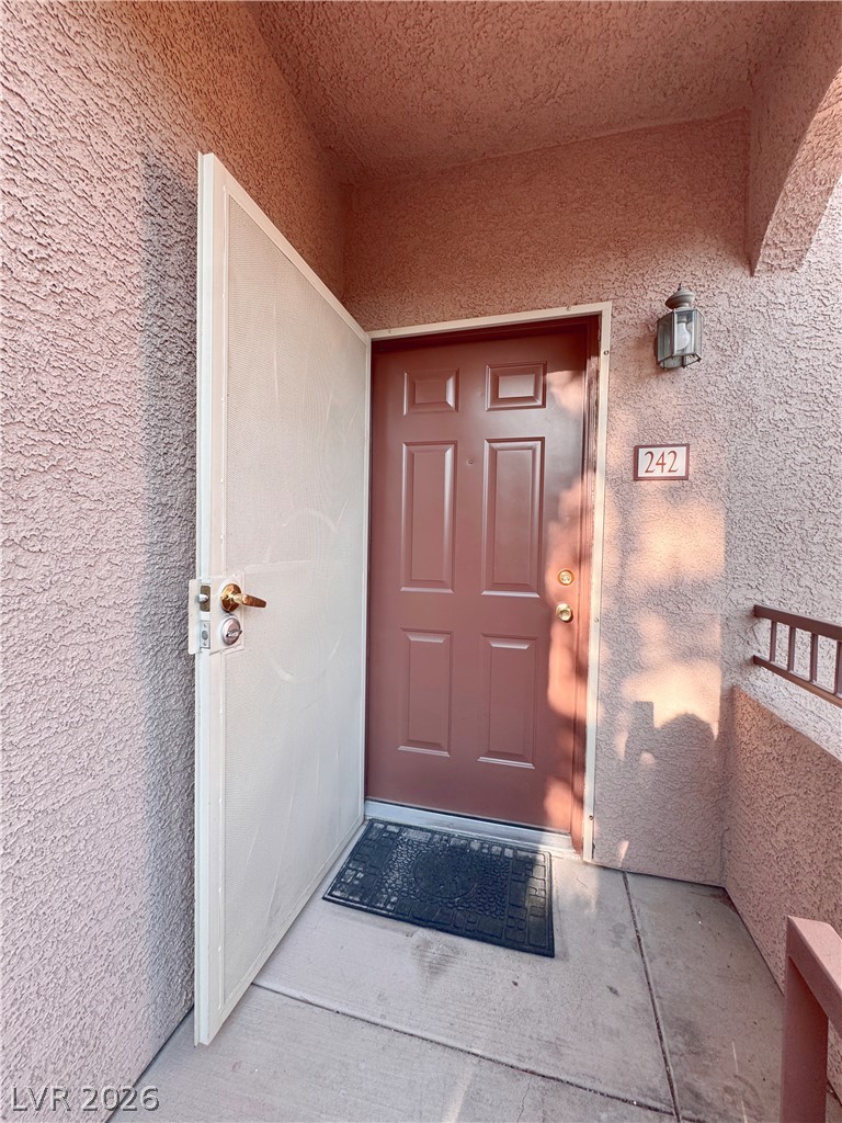 9580 West Reno Avenue, Unit 242 Las Vegas, NV 89148 - Photo 3 of 26 Secure entry welcomes you home, providing peace of mind and inviting curb appeal.
