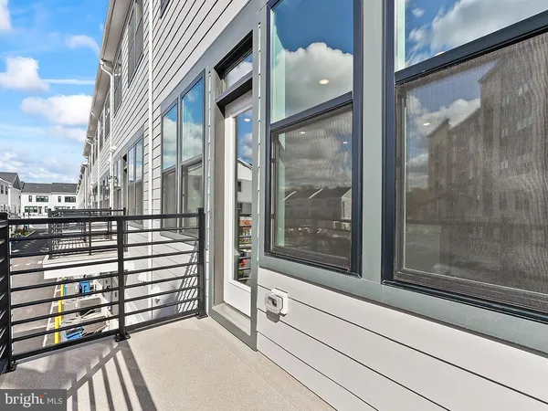 a view of a balcony with a potted plant