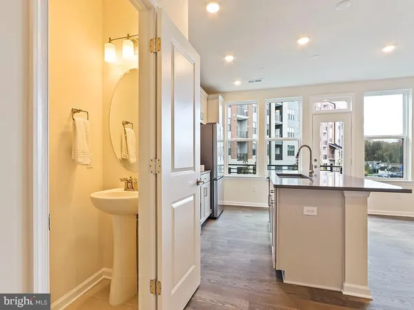 a large bathroom with a glass door shower and sink