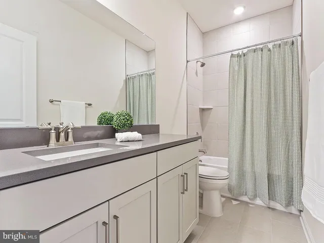 a view of a hallway with washer and dryer