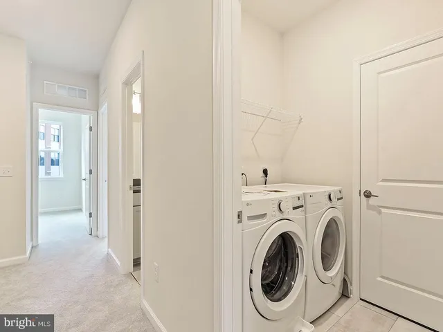 a view of a hallway with closet area