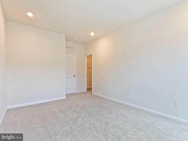 a bathroom with double sink and a mirror