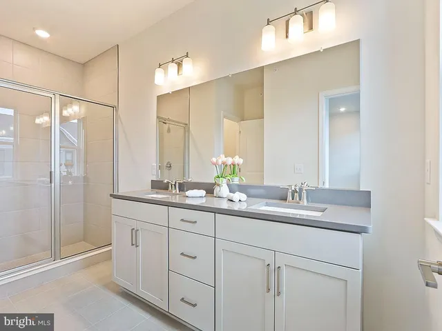a view of a bathroom with a glass shower door