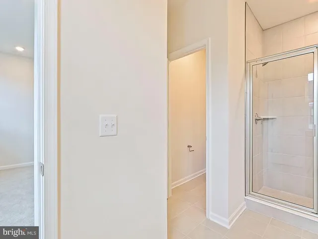 a view of a bathroom with a tub and mirror