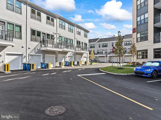 a front view of a house with a white door and wooden floor