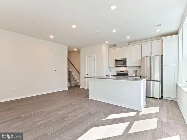 a view of kitchen with wooden floor