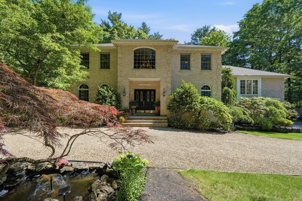 25 Haymeadow Road Boxford, MA 01921 - Photo 2 of 42 a front view of a house with a yard and garage