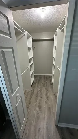 a kitchen with stainless steel appliances granite countertop a refrigerator sink and stove