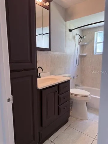 a kitchen with stainless steel appliances a sink stove and cabinets