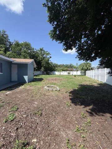 a backyard of a house with lots of green space