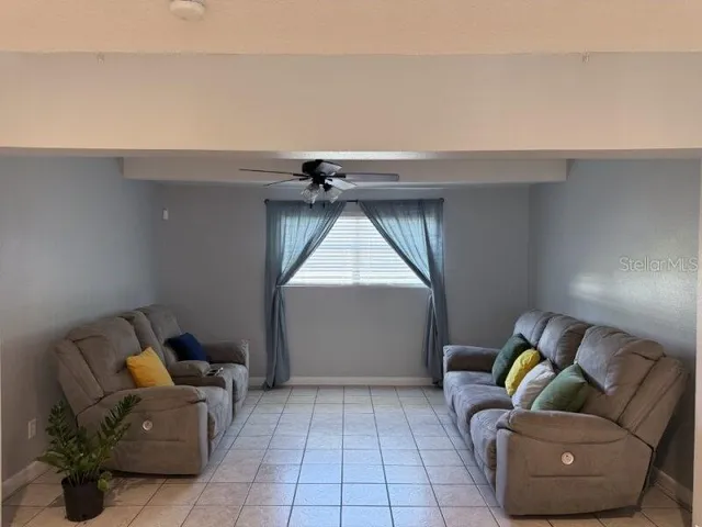 a room with a bed and wooden floor