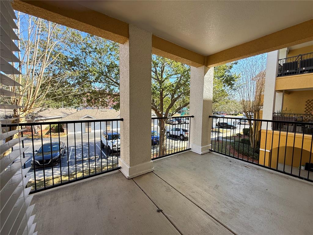3611 Conroy Road, Unit 825 Orlando, FL 32839 - Photo 14 of 27 a view of a porch with wooden floor