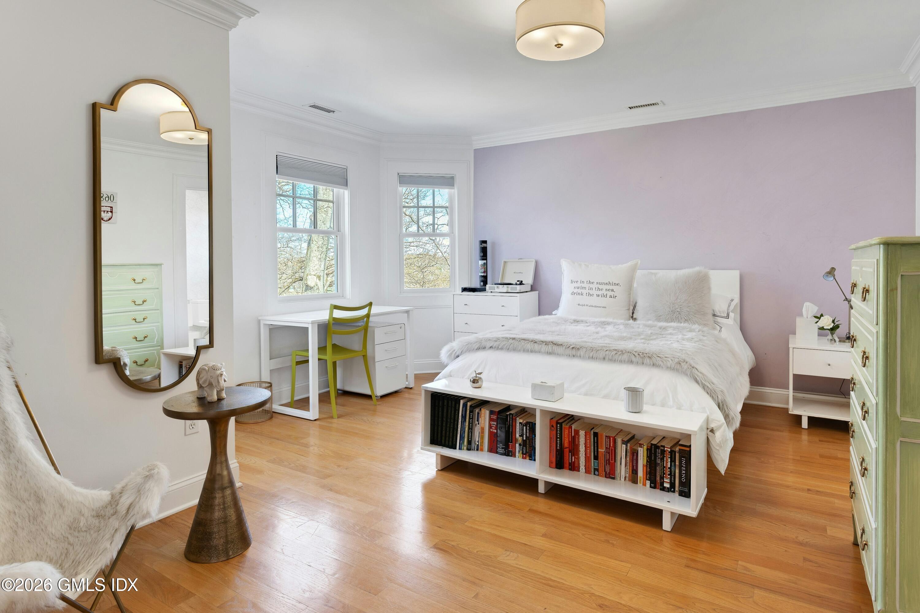16 Summit Road Riverside, CT 06878 - Photo 19 of 34 a spacious bedroom with a bed a table and large windows
