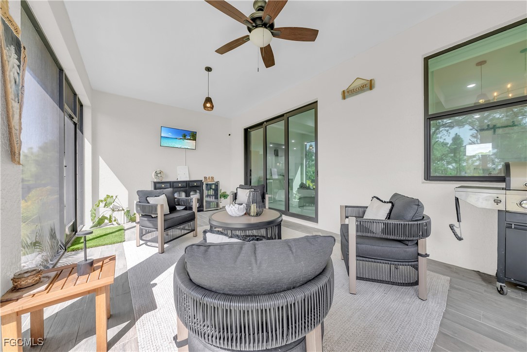 2609 27th Street West Lehigh Acres, FL 33971 - Photo 25 of 35 a living room with furniture and a large window