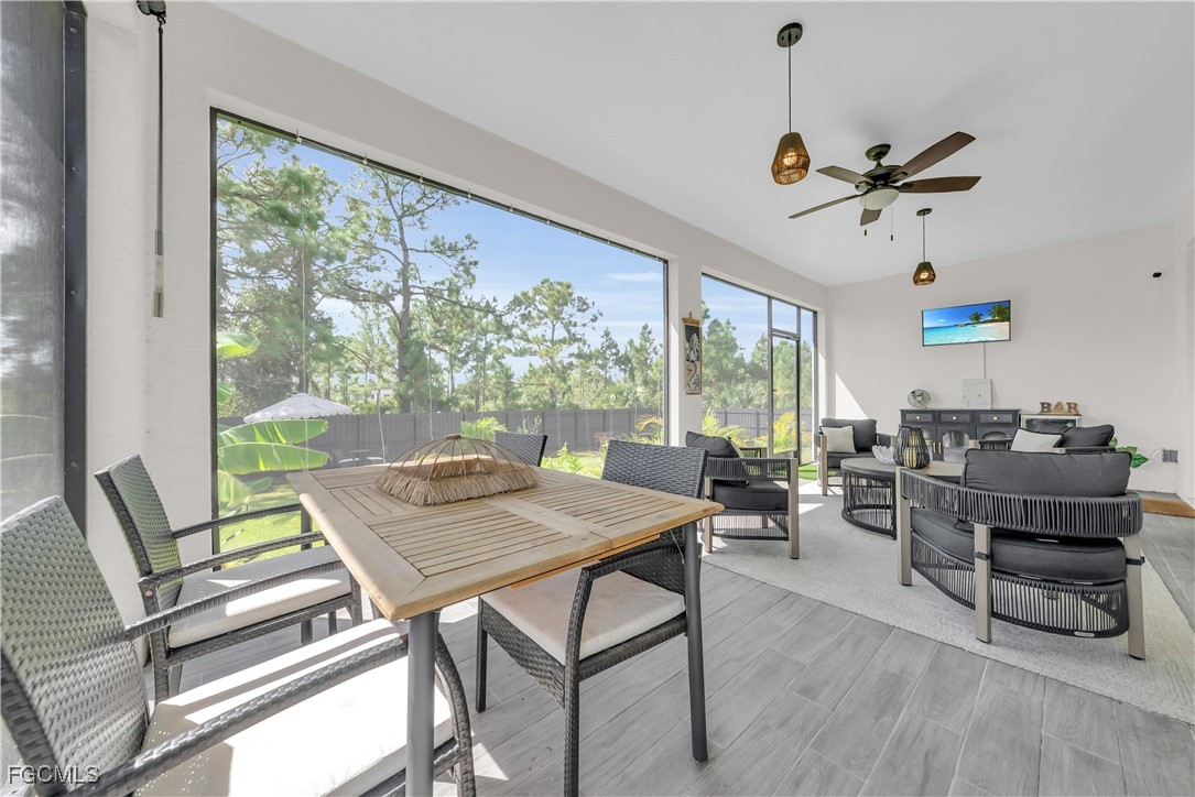 2609 27th Street West Lehigh Acres, FL 33971 - Photo 26 of 35 a view of a dining room with furniture window and outside view