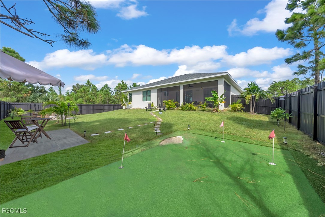 2609 27th Street West Lehigh Acres, FL 33971 - Photo 29 of 35 a view of a house with a yard