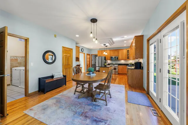 a view of a dining room with furniture window and wooden floor