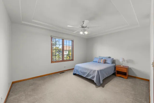 a room with a bed and window