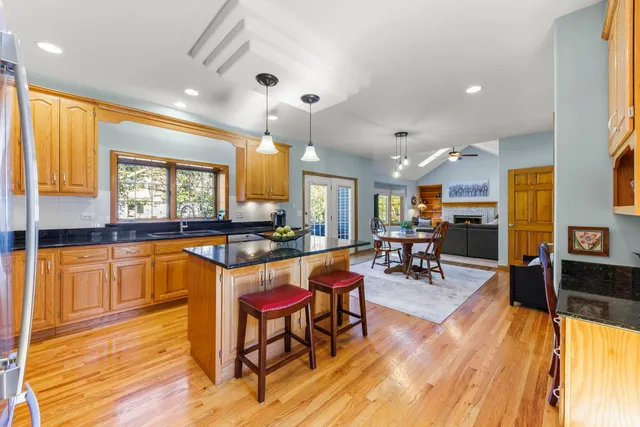 a living room with furniture and kitchen view