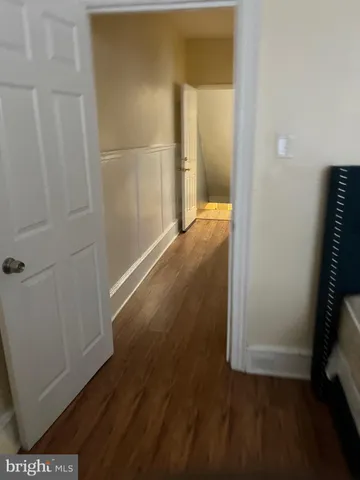 an empty room with wooden floor