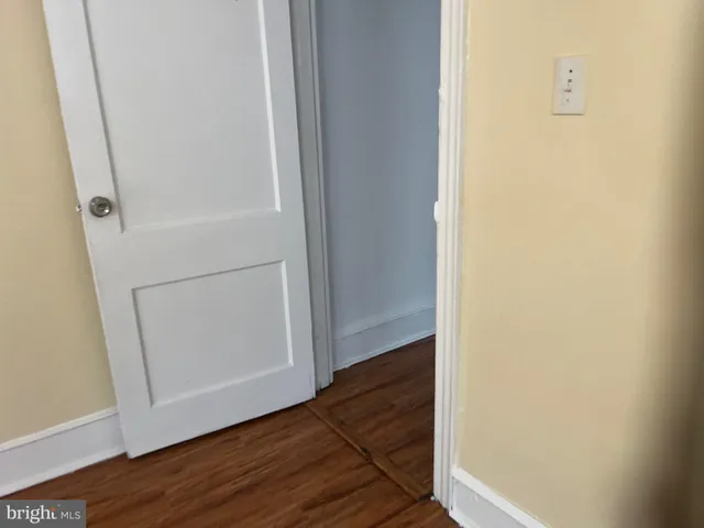 a view of front door with wooden floor