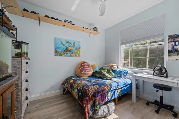 a bedroom with bed and a window