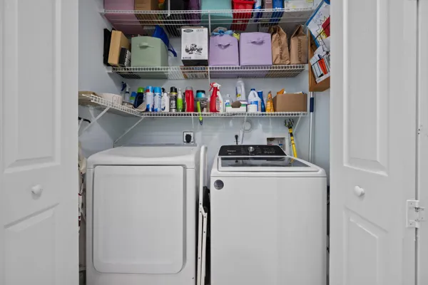 a utility room with washer and dryer
