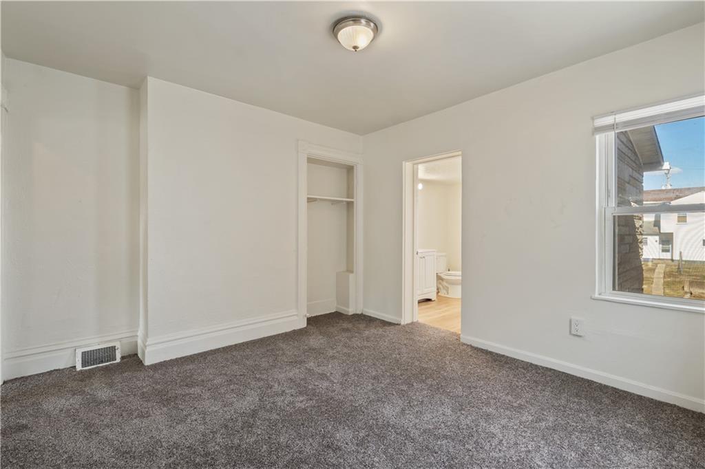 481 Union Street Verona, PA 15147 - Photo 11 of 25 an empty room with windows and closet