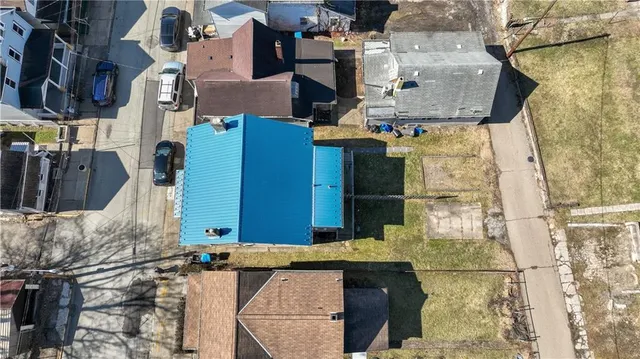 an aerial view of residential houses with outdoor space