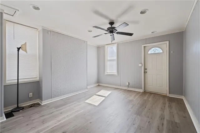 wooden floor in an empty room with a window
