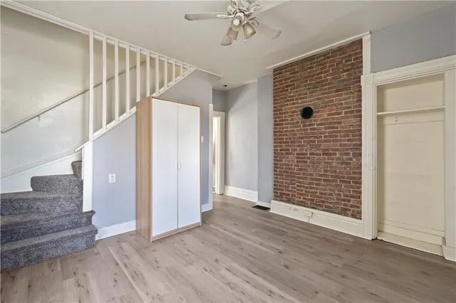 a view of an entryway with wooden floor