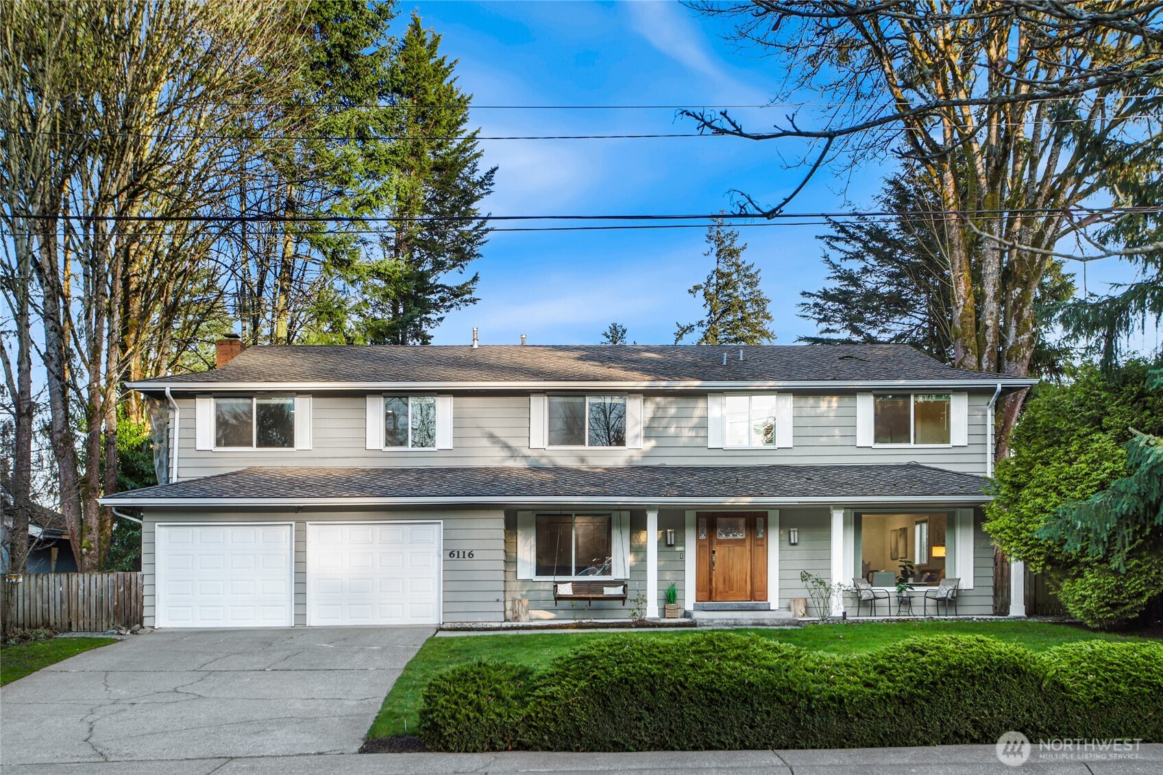6116 152nd Avenue Northeast Redmond, WA 98052 - Photo 1 of 34 a front view of a house with garden
