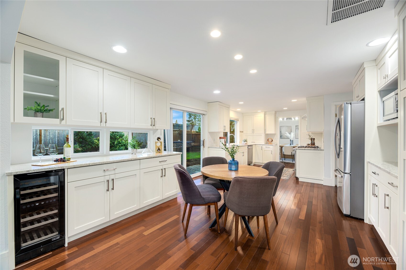 6116 152nd Avenue Northeast Redmond, WA 98052 - Photo 13 of 34 a view of a dining room with furniture window and wooden floor