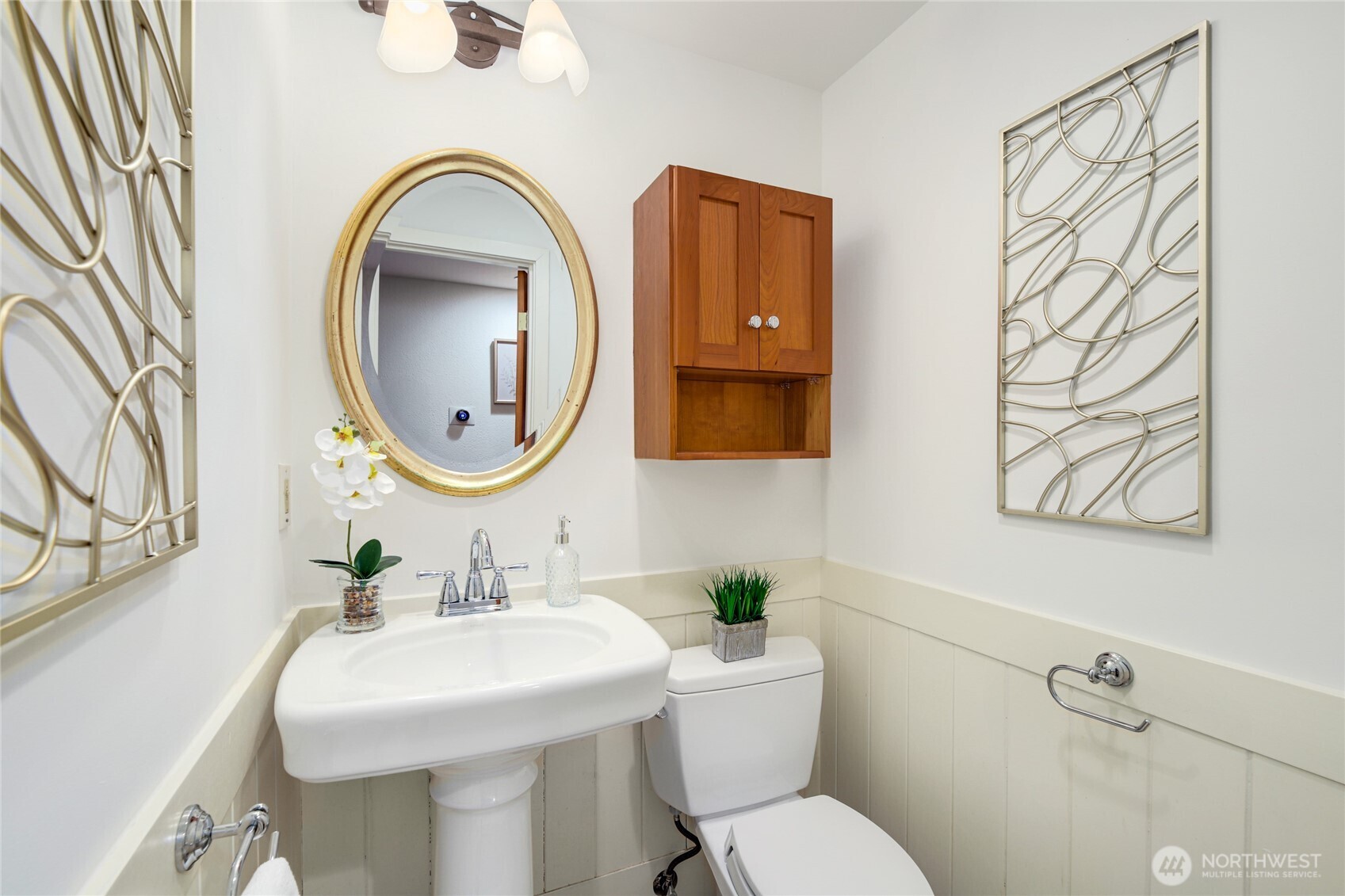 6116 152nd Avenue Northeast Redmond, WA 98052 - Photo 16 of 34 a bathroom with a toilet sink and mirror