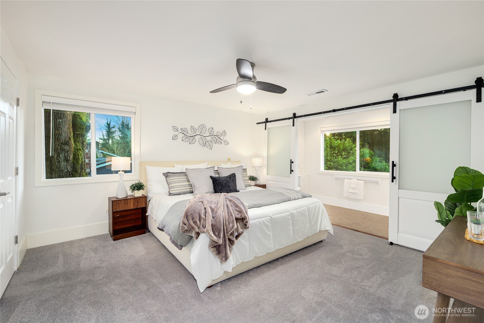 6116 152nd Avenue Northeast Redmond, WA 98052 - Photo 18 of 34 a bedroom with a large bed and a window