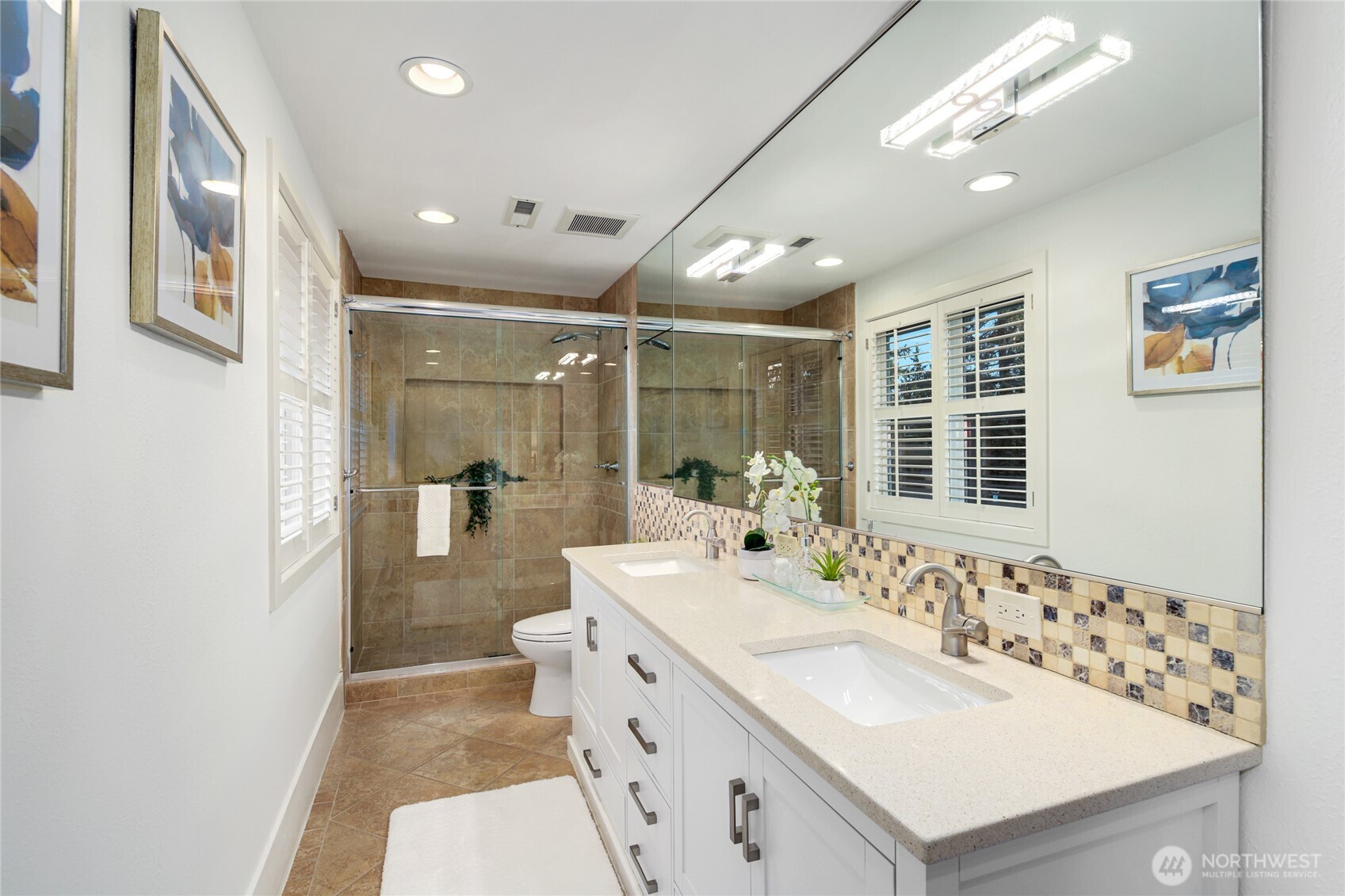 6116 152nd Avenue Northeast Redmond, WA 98052 - Photo 19 of 34 a bathroom with a sink double vanity and a mirror