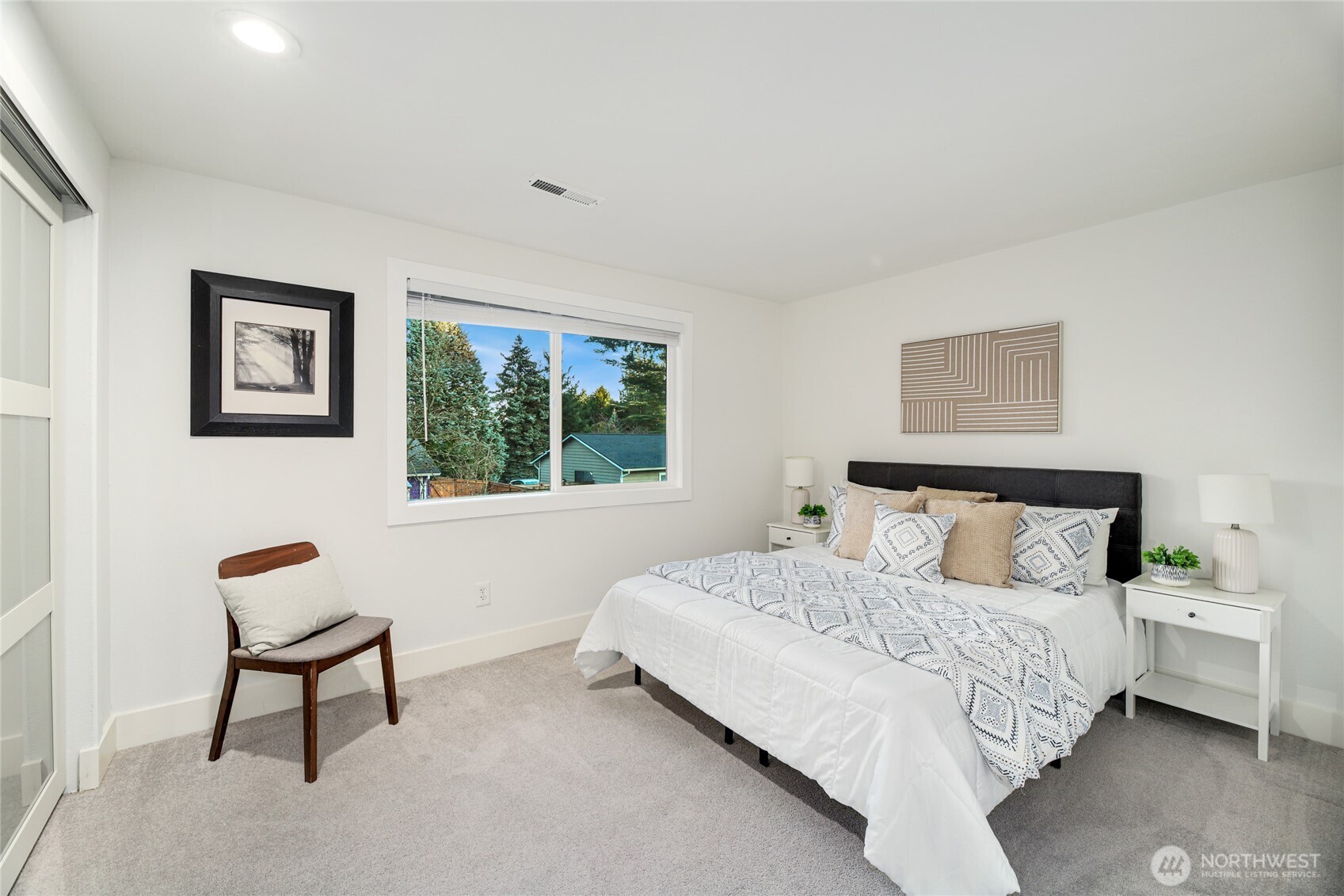 6116 152nd Avenue Northeast Redmond, WA 98052 - Photo 22 of 34 a bedroom with a bed and a window