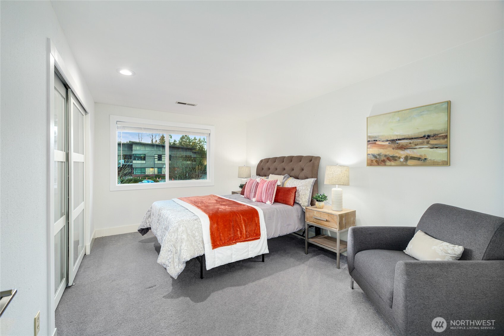 6116 152nd Avenue Northeast Redmond, WA 98052 - Photo 24 of 34 a bed room with a bed and a couch