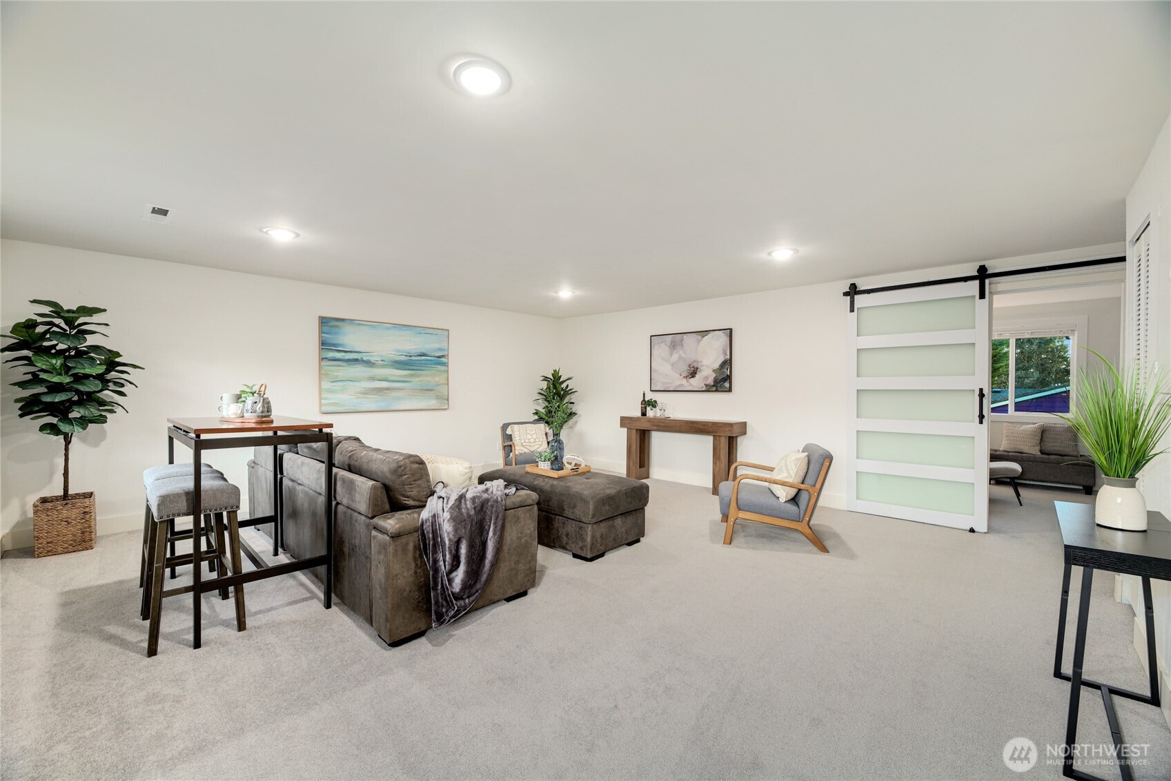6116 152nd Avenue Northeast Redmond, WA 98052 - Photo 30 of 34 a living room with furniture and a potted plant