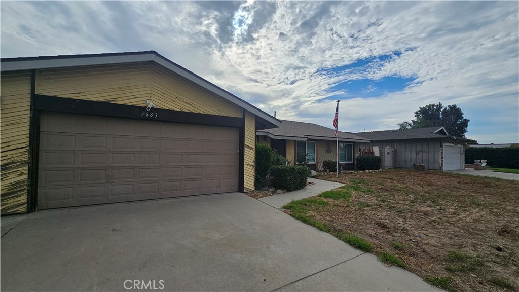 5683 Wagonwheel Road San Bernardino, CA 92407 - Photo 8 of 9 a view of a house with a yard