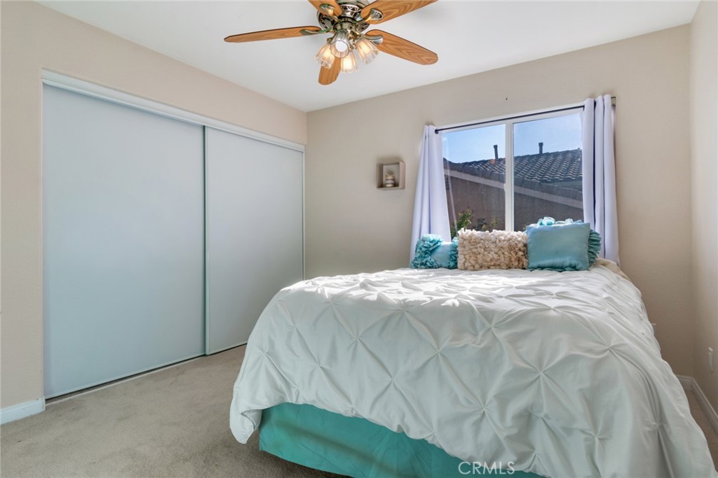 20885 Bakal Drive Riverside, CA 92508 - Photo 22 of 47 a bedroom with a bed and window
