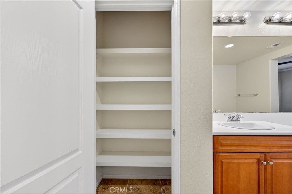 30505 Canyon Hills Road, Unit 1903 Lake Elsinore, CA 92532 - Photo 19 of 36 a bathroom with a sink and a mirror
