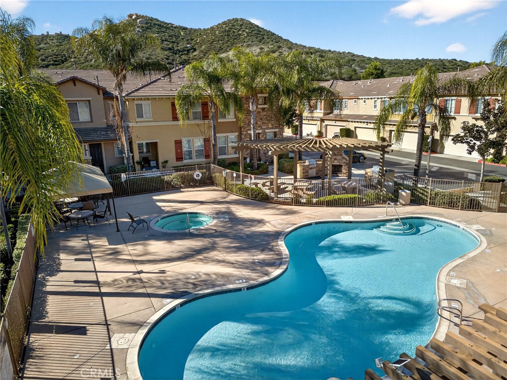 30505 Canyon Hills Road, Unit 1903 Lake Elsinore, CA 92532 - Photo 2 of 36 a view of a swimming pool with a lake view