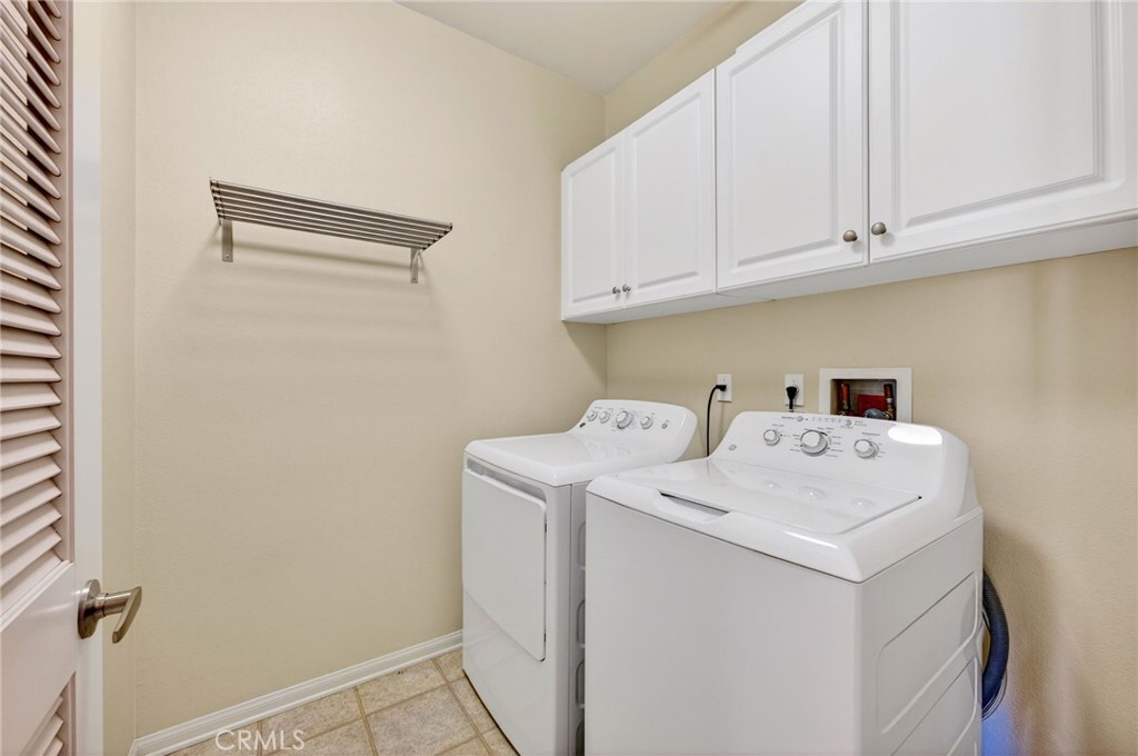 30505 Canyon Hills Road, Unit 1903 Lake Elsinore, CA 92532 - Photo 21 of 36 a utility room with dryer and washer