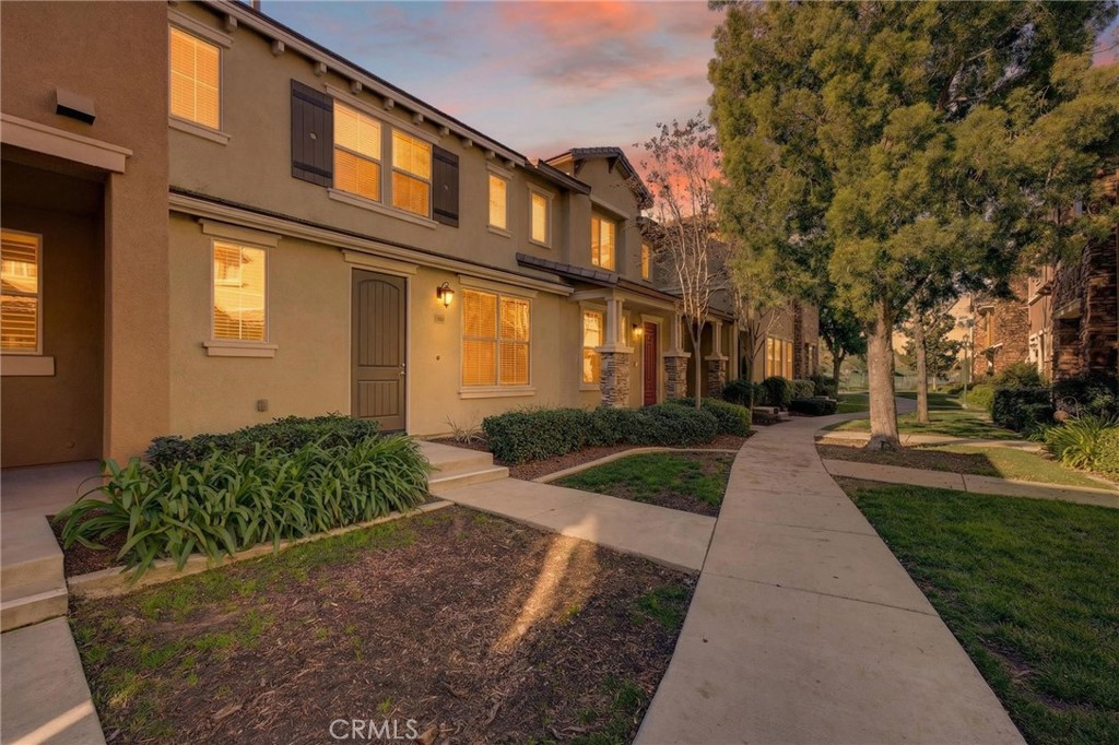 30505 Canyon Hills Road, Unit 1903 Lake Elsinore, CA 92532 - Photo 26 of 36 a front view of a house with garden