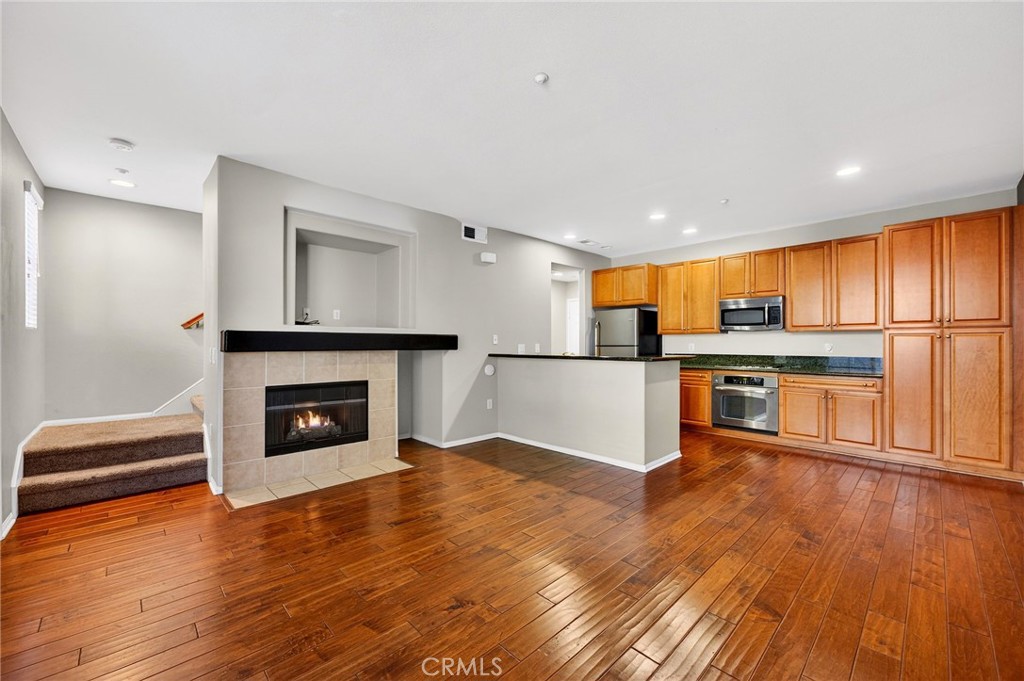 30505 Canyon Hills Road, Unit 1903 Lake Elsinore, CA 92532 - Photo 4 of 36 a view of kitchen with microwave and wooden floor