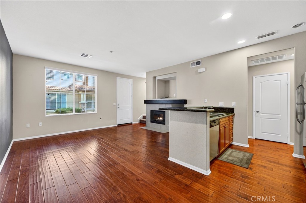 30505 Canyon Hills Road, Unit 1903 Lake Elsinore, CA 92532 - Photo 9 of 36 a view of kitchen with wooden floor and electronic appliances